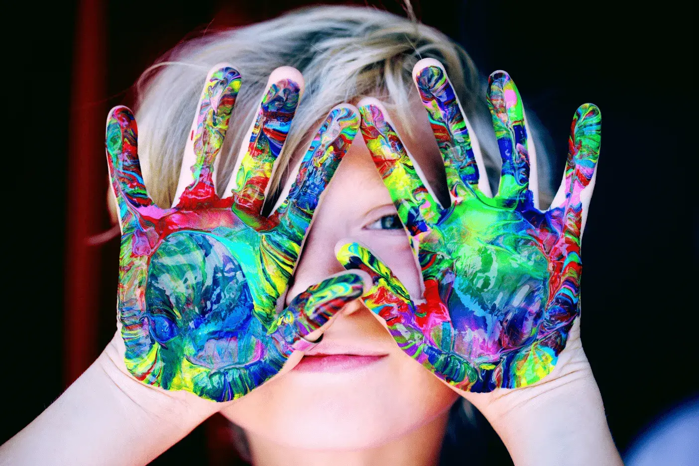 Kid with colorful hands