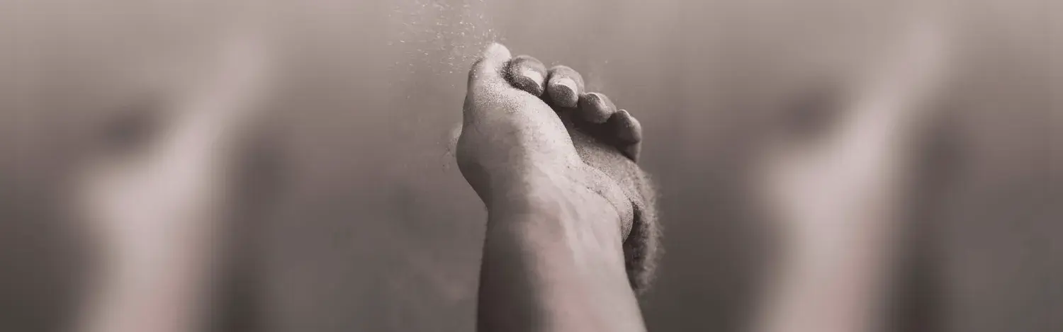 Hand with abrasive material