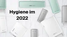 Text im Vordergund: Hygiene im 2022. Darumherum Seifen- und Papierspender in den Farben weiss, mint und silber.