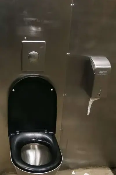 Paper behind toilet