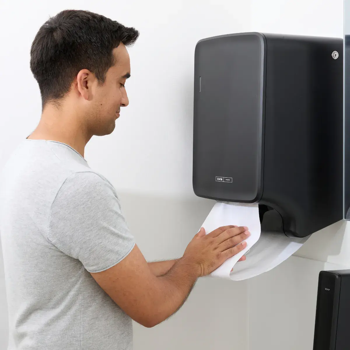 Drying hands with a cotton towel roll