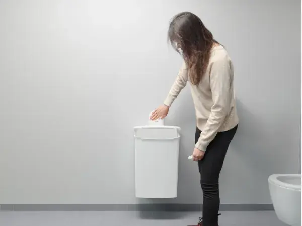 Woman using a hygiene box